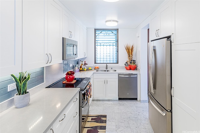 521 Hahaione St Unit 2/12H, Honolulu, HI 96825 - kitchen featuring stainless steel appliances, white cabinets, and light countertops