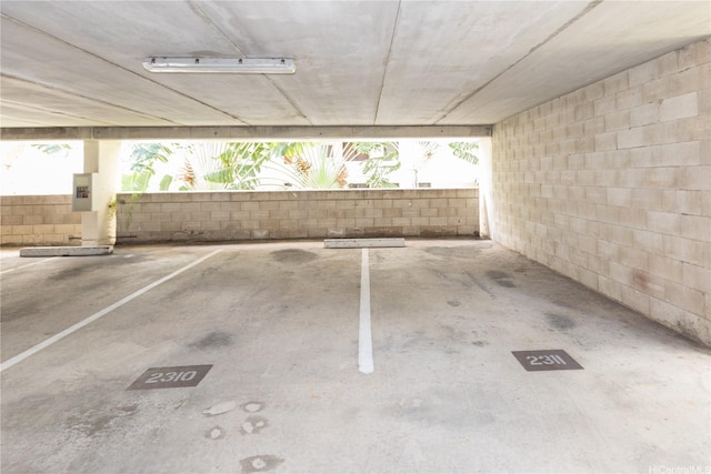 521 Hahaione St Unit 2/12H, Honolulu, HI 96825 - view of car parking featuring a parking garage and electric panel