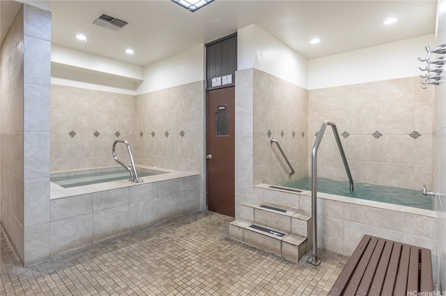 521 Hahaione St Unit 2/12H, Honolulu, HI 96825 - full bathroom with a garden tub, tile patterned floors, and recessed lighting