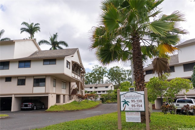95-142 Kuahelani Ave Unit 251, Mililani, HI 96789 - exterior view of stucco siding