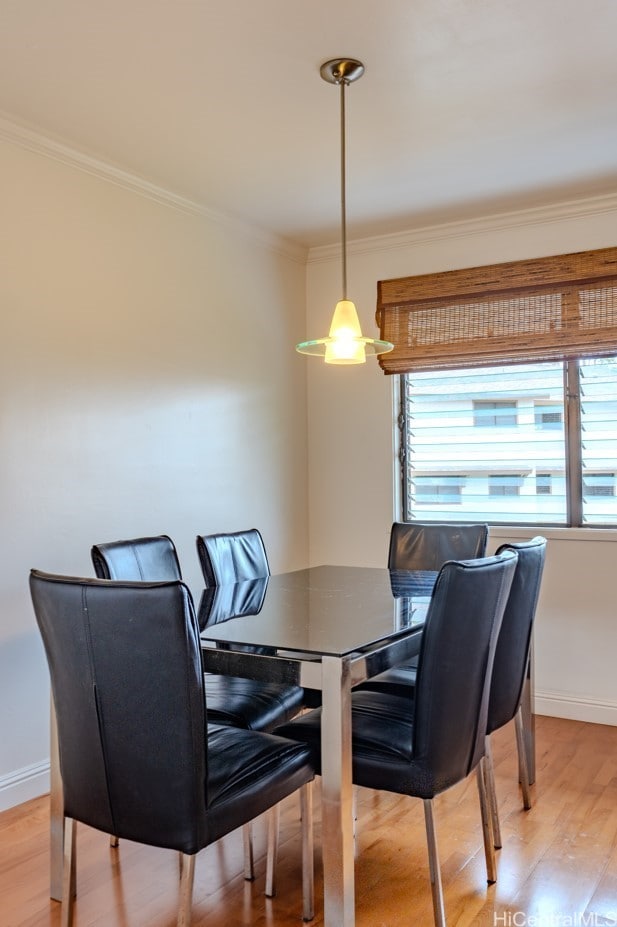 95-142 Kuahelani Ave Unit 251, Mililani, HI 96789 - dining room featuring crown molding and light wood-style floors