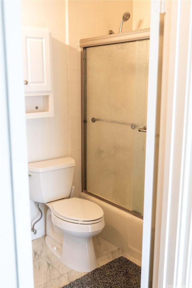 95-142 Kuahelani Ave Unit 251, Mililani, HI 96789 - bathroom with marble look tiles and bath / shower combo with glass door