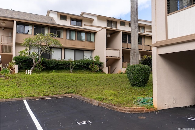 95-142 Kuahelani Ave Unit 251, Mililani, HI 96789 - view of apartment building / complex featuring uncovered parking