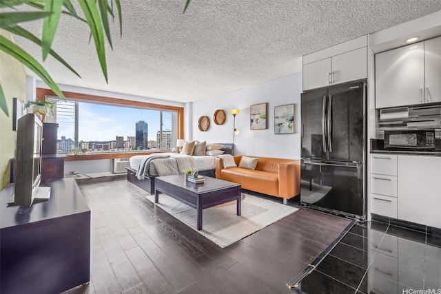 747 Amana St Unit 2206, Honolulu, HI 96814 - living room with a wall mounted air conditioner and a view of skyline