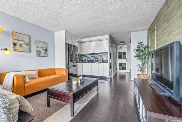 747 Amana St Unit 2206, Honolulu, HI 96814 - living area featuring dark wood finished floors and a textured ceiling