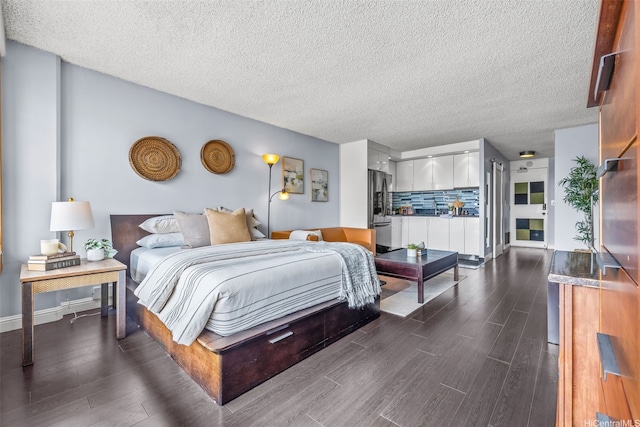 747 Amana St Unit 2206, Honolulu, HI 96814 - bedroom featuring freestanding refrigerator, dark wood-type flooring, and a textured ceiling
