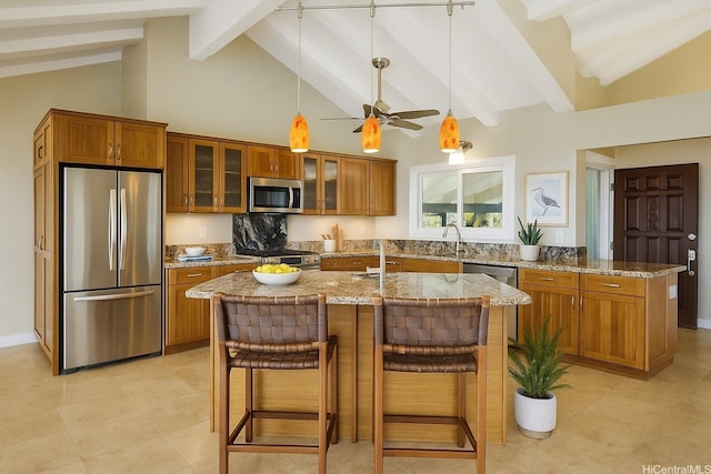 866 Kaahue St, Honolulu, HI 96825 - kitchen featuring appliances with stainless steel finishes, brown cabinets, light stone countertops, beamed ceiling, and pendant lighting