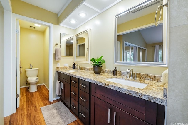 866 Kaahue St, Honolulu, HI 96825 - bathroom featuring double vanity, wood finished floors, and recessed lighting