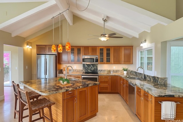 866 Kaahue St, Honolulu, HI 96825 - kitchen featuring stainless steel appliances, brown cabinets, beamed ceiling, a breakfast bar, and dark stone counters