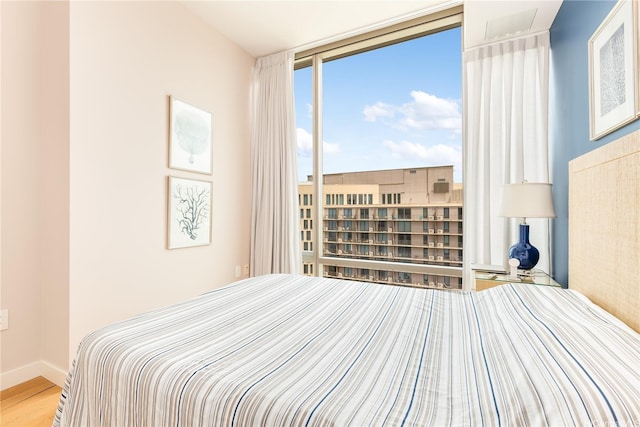 1001 Queen St Unit 3907, Honolulu, HI 96814 - bedroom with wood finished floors and baseboards
