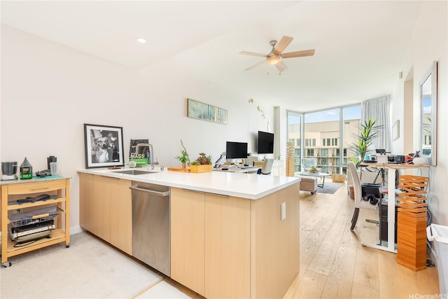 1001 Queen St Unit 3907, Honolulu, HI 96814 - kitchen with dishwasher, an office area, light wood-type flooring, ceiling fan, and light countertops