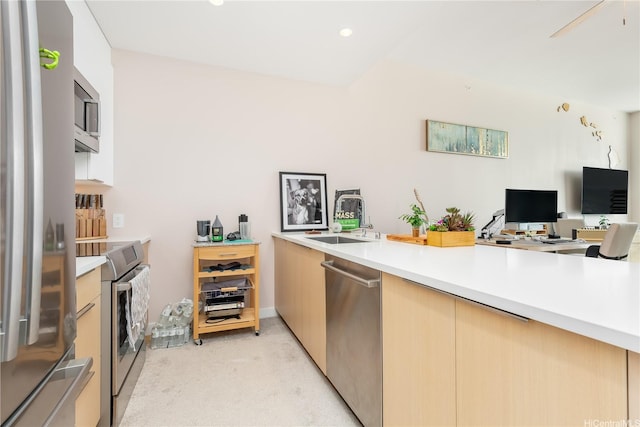 1001 Queen St Unit 3907, Honolulu, HI 96814 - kitchen featuring appliances with stainless steel finishes, light carpet, light countertops, an office area, and modern cabinets
