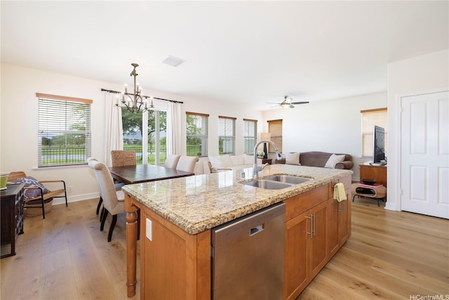 91-1144 Kaikohola St Unit D71, Ewa Beach, HI 96706 - kitchen featuring stainless steel dishwasher, light wood-style floors, a kitchen island with sink, a chandelier, and light stone countertops
