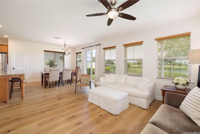 91-1144 Kaikohola St Unit D71, Ewa Beach, HI 96706 - living area with a chandelier, light wood-style floors, a ceiling fan, and recessed lighting