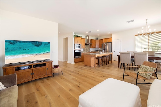 91-1144 Kaikohola St Unit D71, Ewa Beach, HI 96706 - living area with a chandelier, light wood-type flooring, and recessed lighting