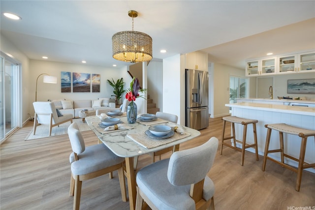 539 Keolu Dr Unit C, Kailua, HI 96734 - dining space with stairway, a chandelier, light wood-style flooring, and recessed lighting