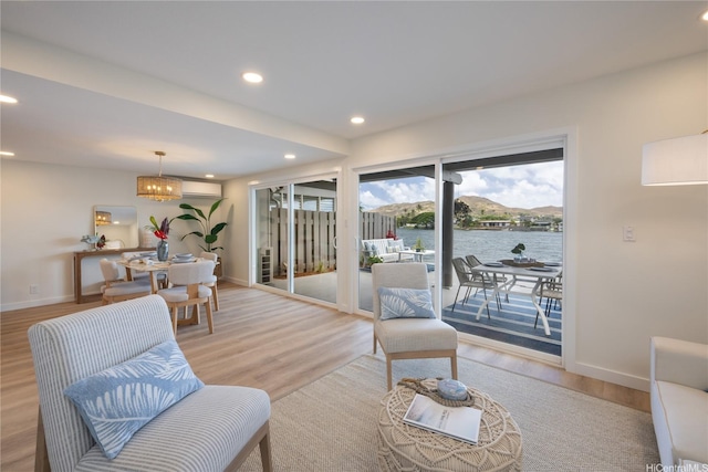 539 Keolu Dr Unit C, Kailua, HI 96734 - living room with light wood-style flooring, a chandelier, recessed lighting, and a water view
