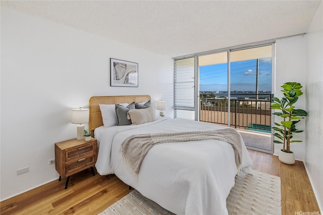 98-099 Uao Pl Unit 506, Aiea, HI 96701 - bedroom with access to outside and wood finished floors