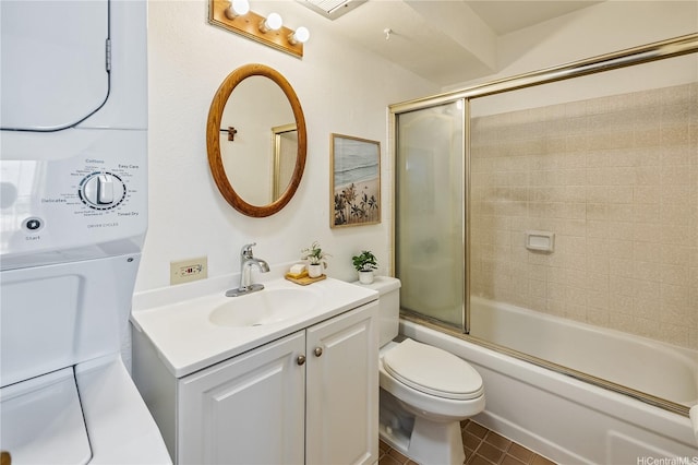 98-099 Uao Pl Unit 506, Aiea, HI 96701 - full bathroom with vanity, bath / shower combo with glass door, stacked washing machine and dryer, and tile patterned flooring