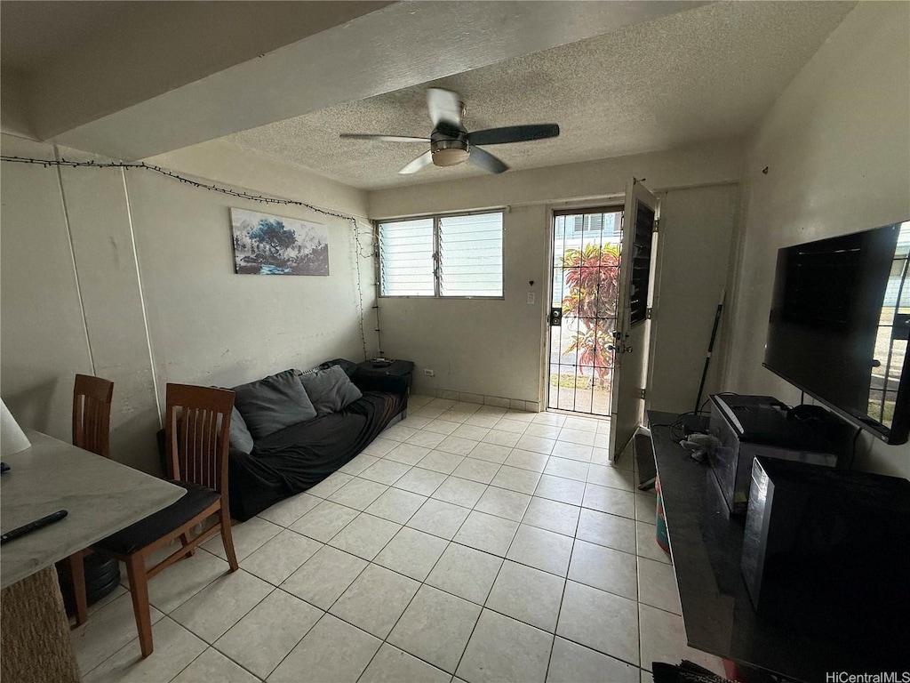 908 University Ave Unit A105, Honolulu, HI 96826 - living room with ceiling fan, light tile patterned floors, and a textured ceiling
