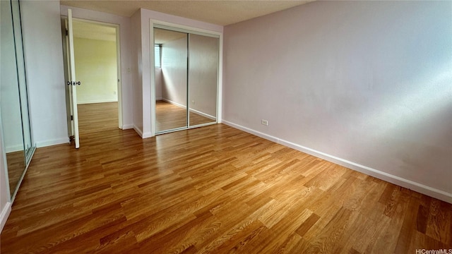 1121 Wilder Ave Unit 900B, Honolulu, HI 96822 - unfurnished bedroom with wood finished floors and a closet