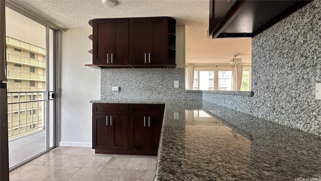 1121 Wilder Ave Unit 900B, Honolulu, HI 96822 - kitchen with exhaust hood, open shelves, decorative backsplash, dark brown cabinetry, and a textured ceiling