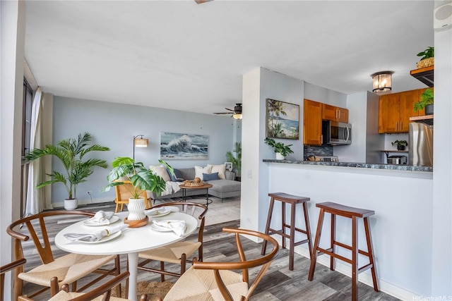 322 Aoloa St Unit 1110, Kailua, HI 96734 - dining area with wood finished floors and ceiling fan