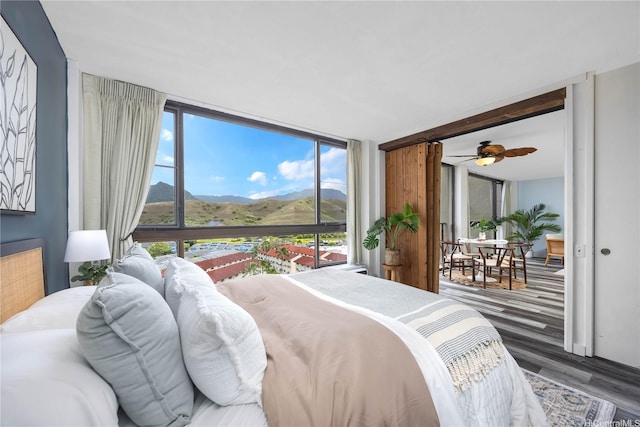 322 Aoloa St Unit 1110, Kailua, HI 96734 - bedroom featuring wood finished floors, a mountain view, and expansive windows
