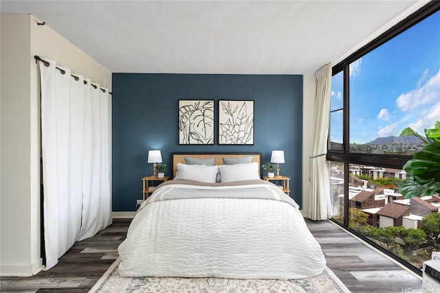 322 Aoloa St Unit 1110, Kailua, HI 96734 - bedroom featuring wood finished floors, a wall of windows, and a mountain view