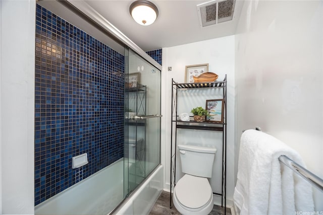 322 Aoloa St Unit 1110, Kailua, HI 96734 - bathroom featuring bath / shower combo with glass door and wood finished floors