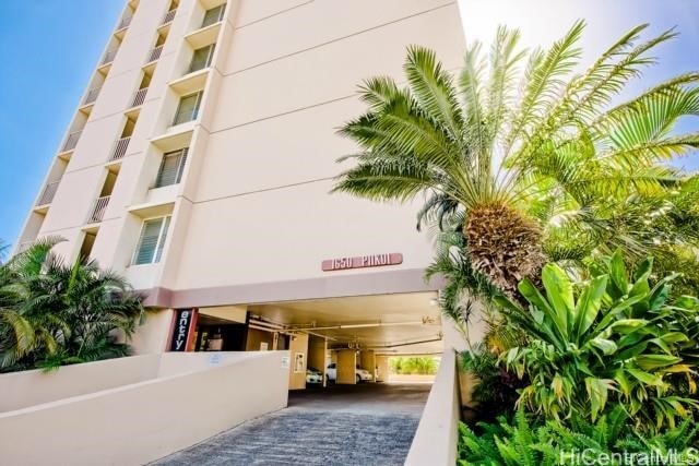 1650 Piikoi St Unit 403, Honolulu, HI 96822 - view of property featuring a carport