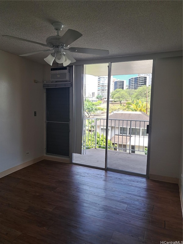 1650 Piikoi St Unit 403, Honolulu, HI 96822 - spare room with wood finished floors, ceiling fan, a textured ceiling, and a wall mounted AC