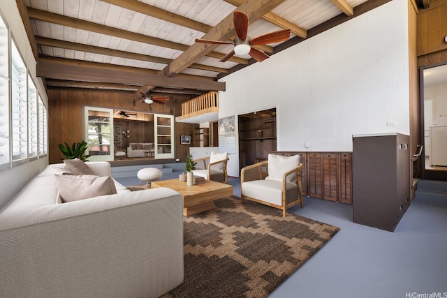 44 Akamu Pl, Honolulu, HI 96817 - living area with ceiling fan, wood walls, a wood ceiling with exposed beams, and finished concrete floors