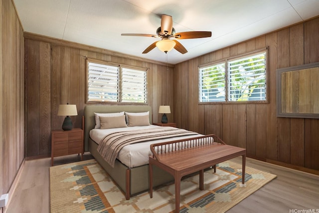 44 Akamu Pl, Honolulu, HI 96817 - bedroom with wood walls and light wood-style floors