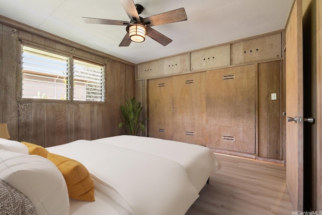 44 Akamu Pl, Honolulu, HI 96817 - bedroom with wooden walls, wood finished floors, and ceiling fan