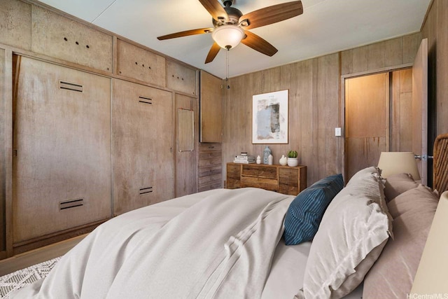 44 Akamu Pl, Honolulu, HI 96817 - bedroom featuring wood walls and a ceiling fan