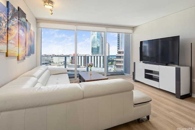 1288 Kapiolani Blvd Unit I-1506, Honolulu, HI 96814 - living area featuring light wood-style floors and floor to ceiling windows