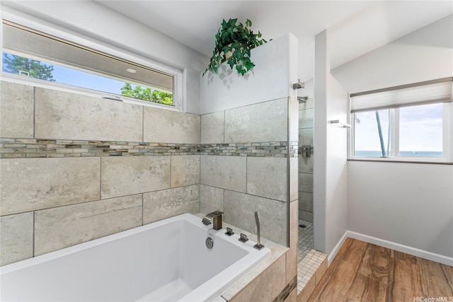84-663 Upena St, Waianae, HI 96792 - bathroom featuring a garden tub, plenty of natural light, a tile shower, and wood finished floors