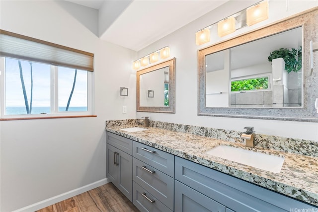 84-663 Upena St, Waianae, HI 96792 - bathroom featuring wood finished floors and double vanity