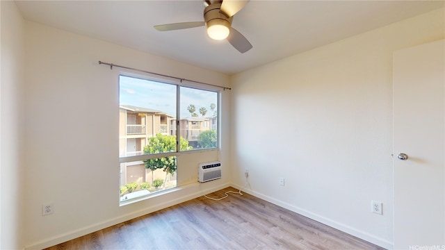 91-1201 Kaneana St Unit 3J, Ewa Beach, HI 96706 - unfurnished room with light wood-type flooring, ceiling fan, and a wall unit AC