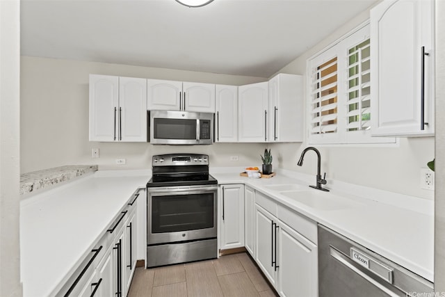 46-109 Konohiki St Unit 3922, Kaneohe, HI 96744 - kitchen featuring stainless steel appliances, white cabinets, and light countertops