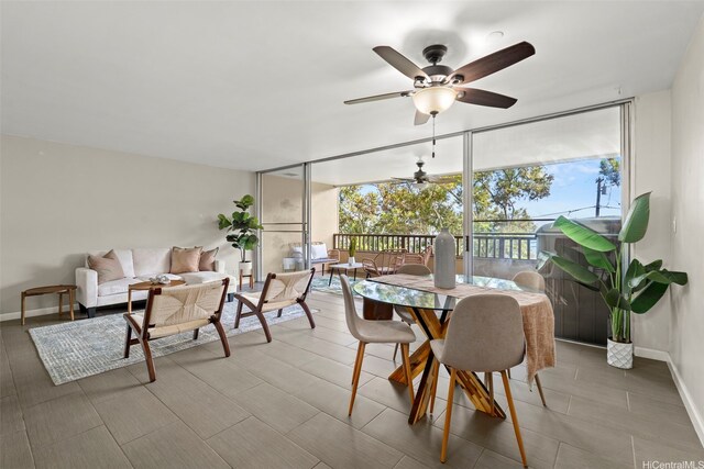 46-109 Konohiki St Unit 3922, Kaneohe, HI 96744 - dining space featuring a ceiling fan and a wall of windows
