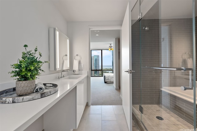 1001 Queen St Unit 2506, Honolulu, HI 96814 - bathroom featuring vanity, tile patterned floors, a shower stall, and ensuite bathroom