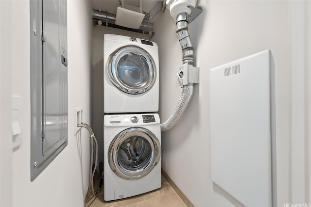 1001 Queen St Unit 2506, Honolulu, HI 96814 - laundry area featuring stacked washer / drying machine and light tile patterned floors