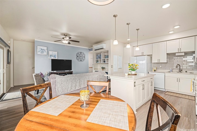 91-3633 Kauluakoko St Unit 412, Ewa Beach, HI 96706 - dining room featuring a wall mounted air conditioner, a ceiling fan, light wood finished floors, and recessed lighting