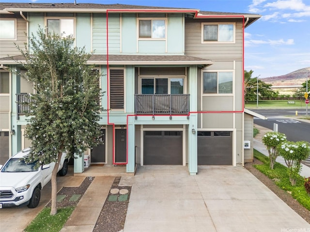 91-3633 Kauluakoko St Unit 412, Ewa Beach, HI 96706 - townhome / multi-family property featuring driveway, a garage, a mountain view, and a shingled roof