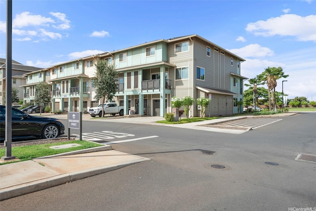 91-3633 Kauluakoko St Unit 412, Ewa Beach, HI 96706 - view of building exterior featuring uncovered parking and a residential view