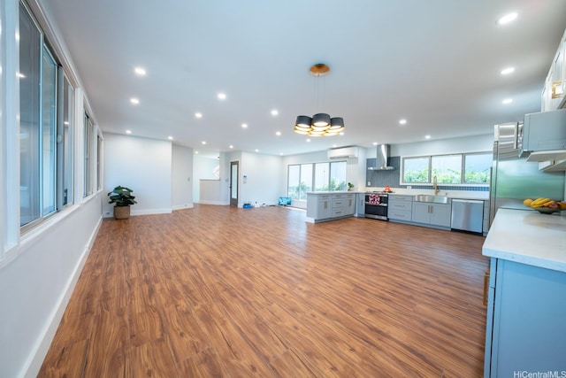 1207 Lilo Pl, Honolulu, HI 96822 - unfurnished living room with recessed lighting, wood finished floors, and a chandelier