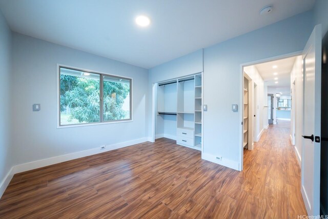 1207 Lilo Pl, Honolulu, HI 96822 - unfurnished bedroom with wood finished floors and a closet
