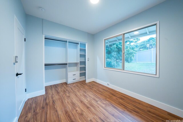 1207 Lilo Pl, Honolulu, HI 96822 - unfurnished bedroom with wood finished floors and a closet